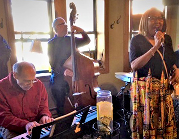 Esther singing at the Eastgate Cafe