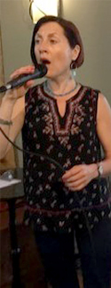 Sabina singing at the Eastgate Cafe