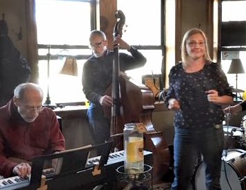 Kate singing at the Eastgate Cafe